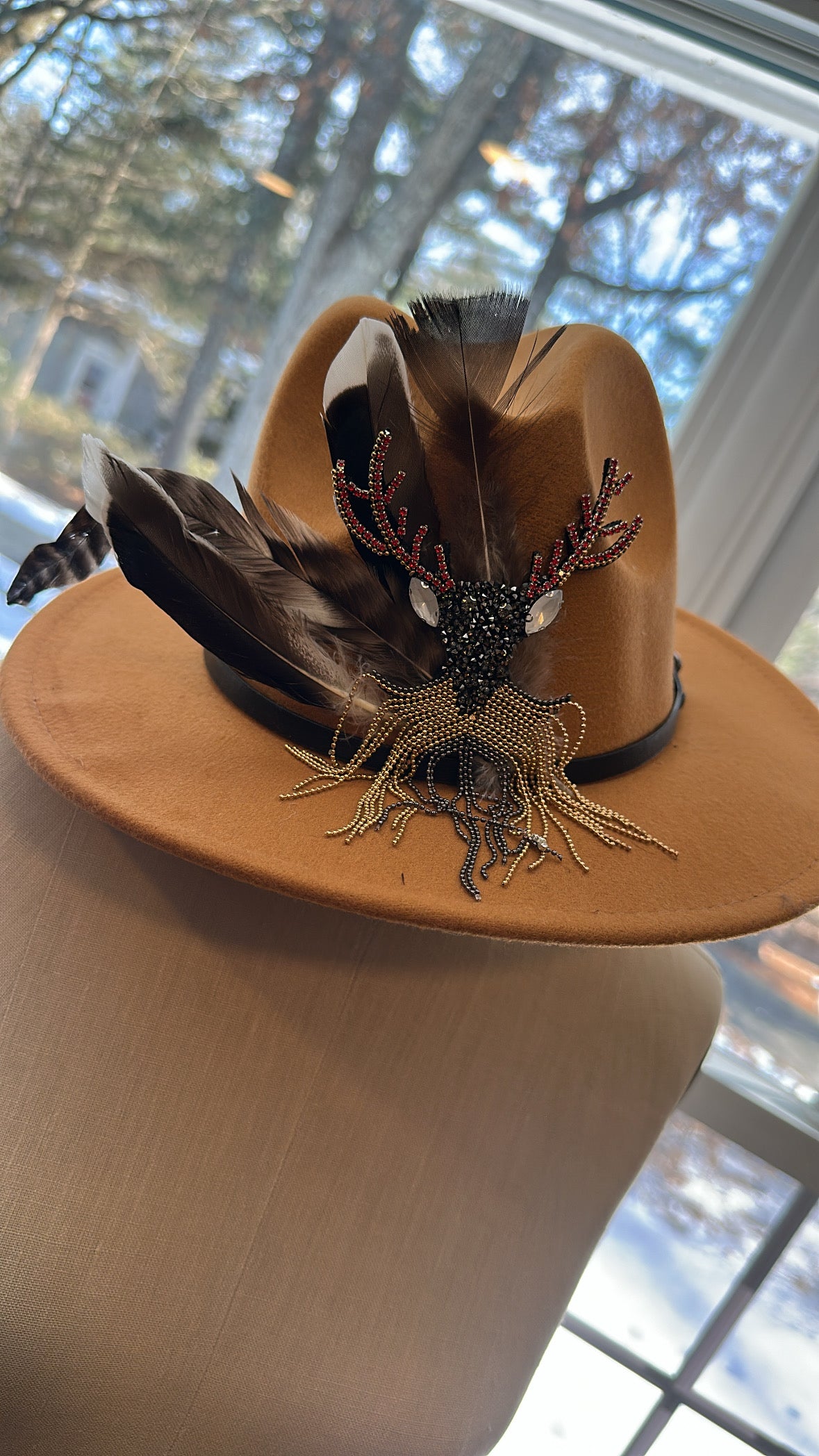 One-of-a-kind hand-embellished statement hat