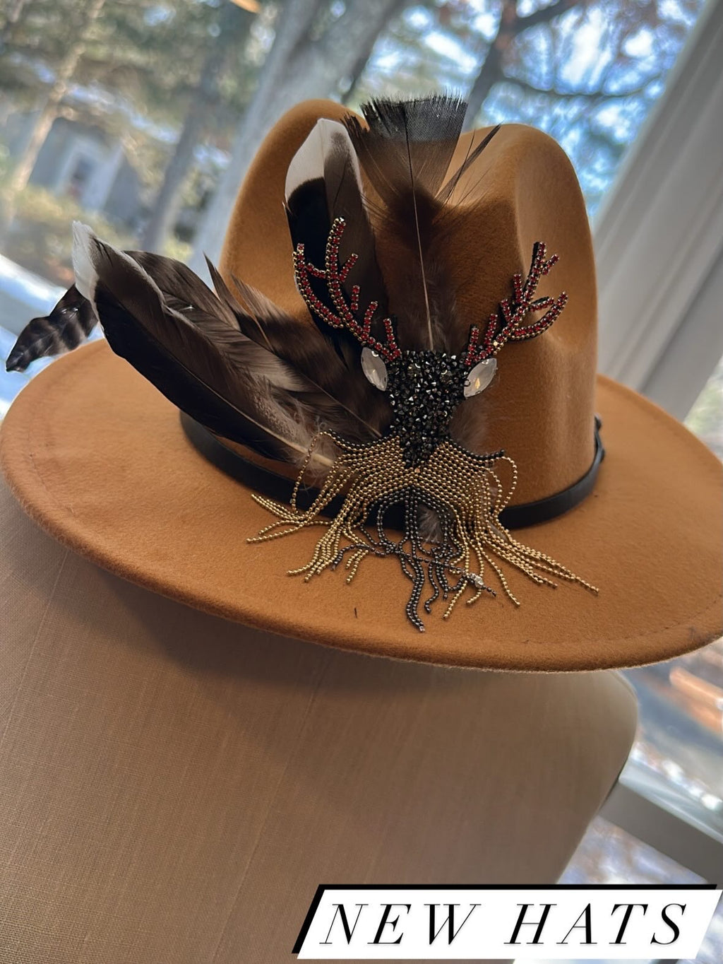 One-of-a-kind hand-embellished statement hat